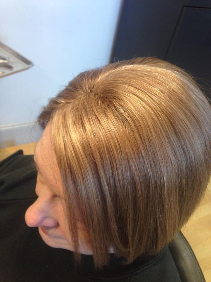 woman from top with full hair from evolve treatment