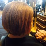 woman from back with full hair from evolve treatment