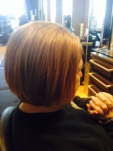 woman from back with full hair from evolve treatment