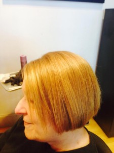 woman from left side with full hair from evolve treatment