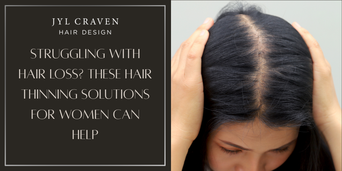 A woman looks down and parts her dark hair to reveal thinning at the scalp; text offers hair thinning solutions and an extensions guide for women at Jyl Craven Hair Design.