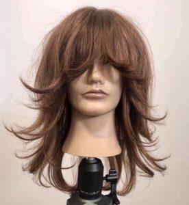Mannequin with a shag haircut ends are styled outwards