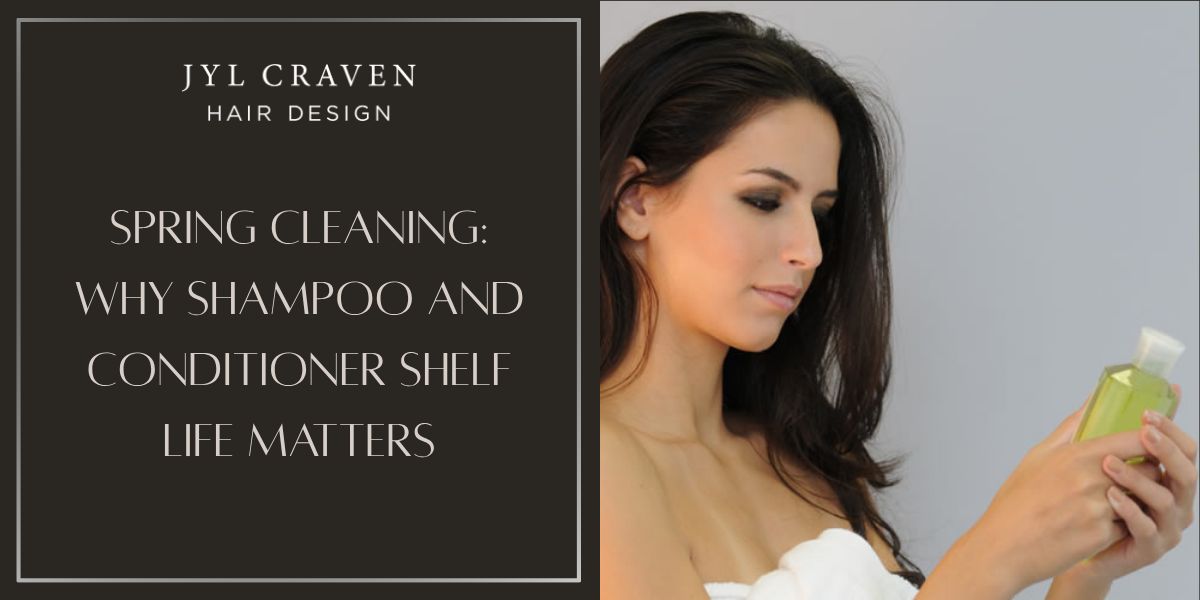 A woman examines a shampoo bottle, next to a sign reading "Spring Cleaning: Why Shampoo and Conditioner Shelf Life Matters" from Jyl Craven Hair Design.