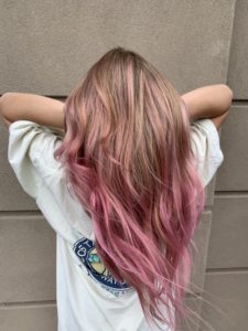 Pink highlights after hair color correction from brunette to blonde