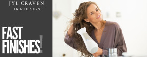 woman blow drying her hair for article on styling hair fast