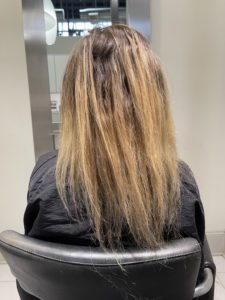Dark blond uneven highlights in need of correction
